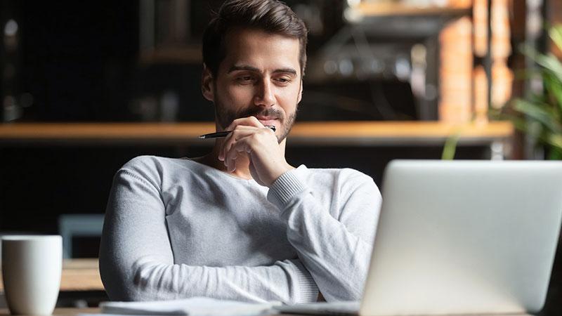 Adult student with open laptop